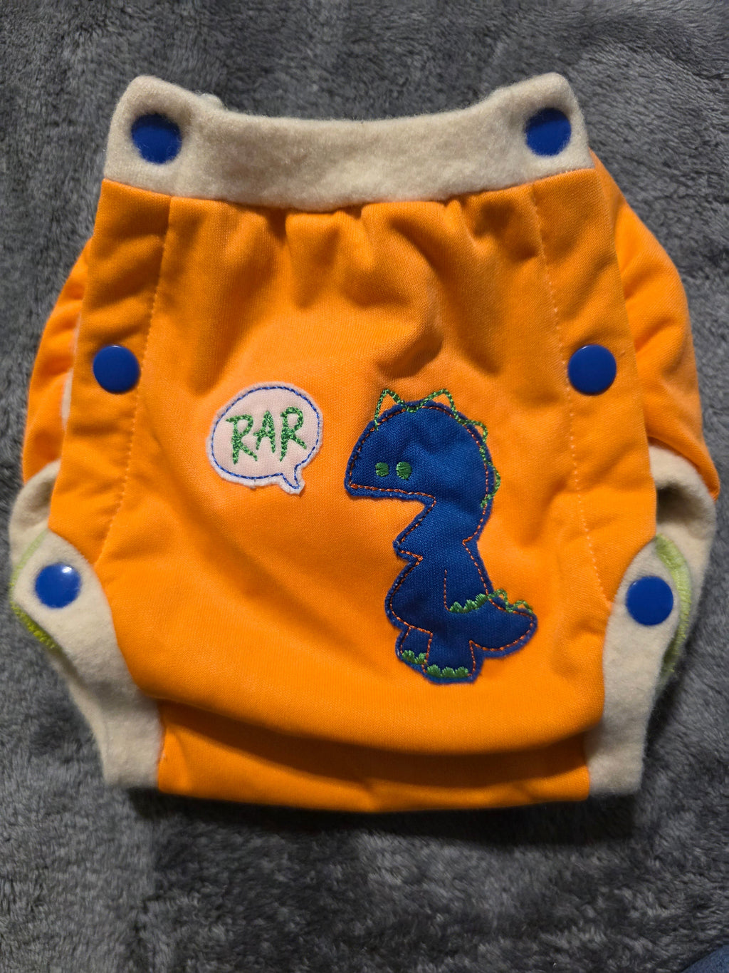 Wool? Edging. Trainer. Says 3t but is small. Never worn. Friend gifted.