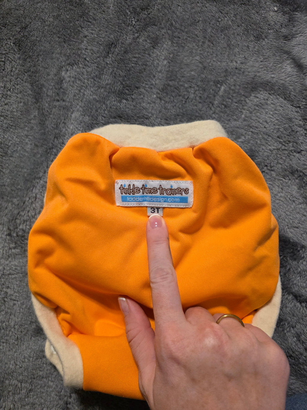 Wool? Edging. Trainer. Says 3t but is small. Never worn. Friend gifted.