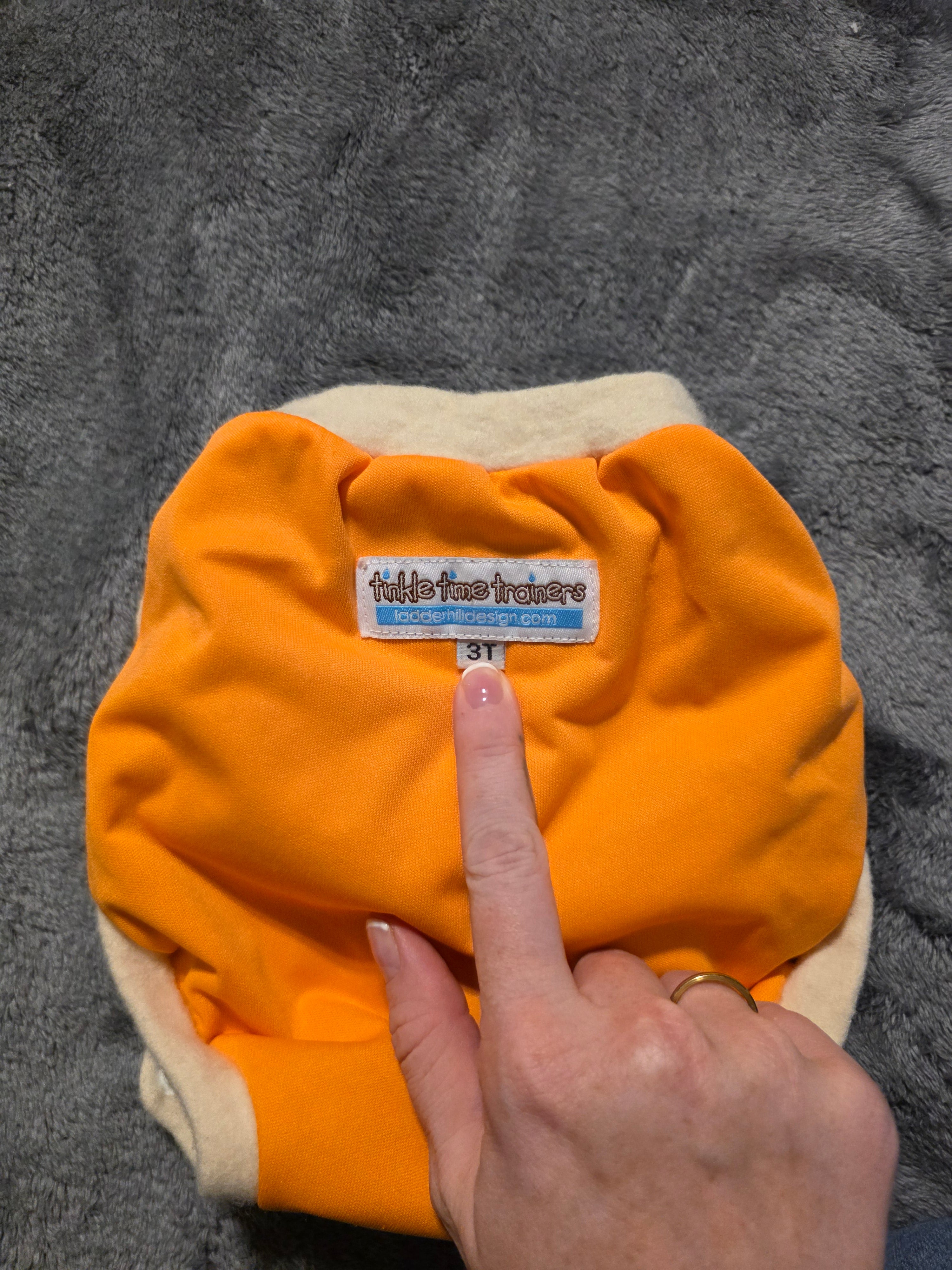 Wool? Edging. Trainer. Says 3t but is small. Never worn. Friend gifted.
